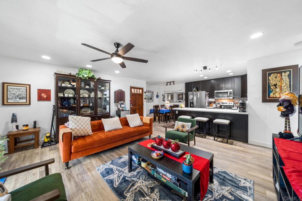 500 Telegraph Canyon Road, Unit H Chula Vista, CA 91910 - Photo 2 of 36 a living room with furniture and wooden floor