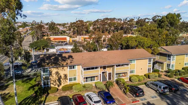 a view of a house with a yard and sitting area
