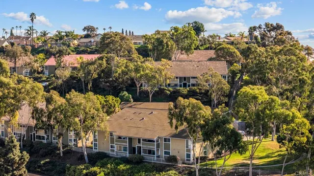 an aerial view of residential building and car parked