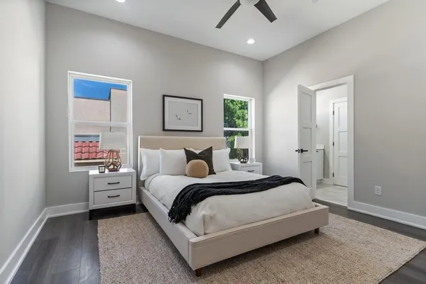 a bedroom with a bed and window