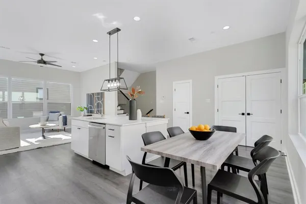 a kitchen with sink stove and cabinets