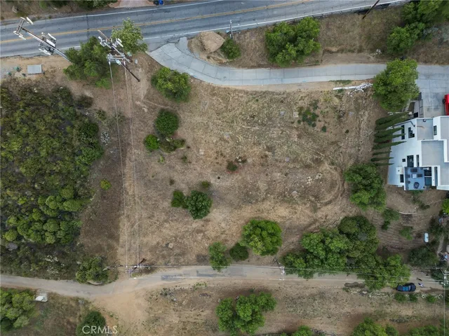 an aerial view of a house with a yard and a garden