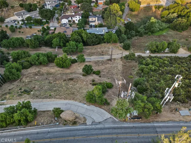 an aerial view of a house a yard and lake view