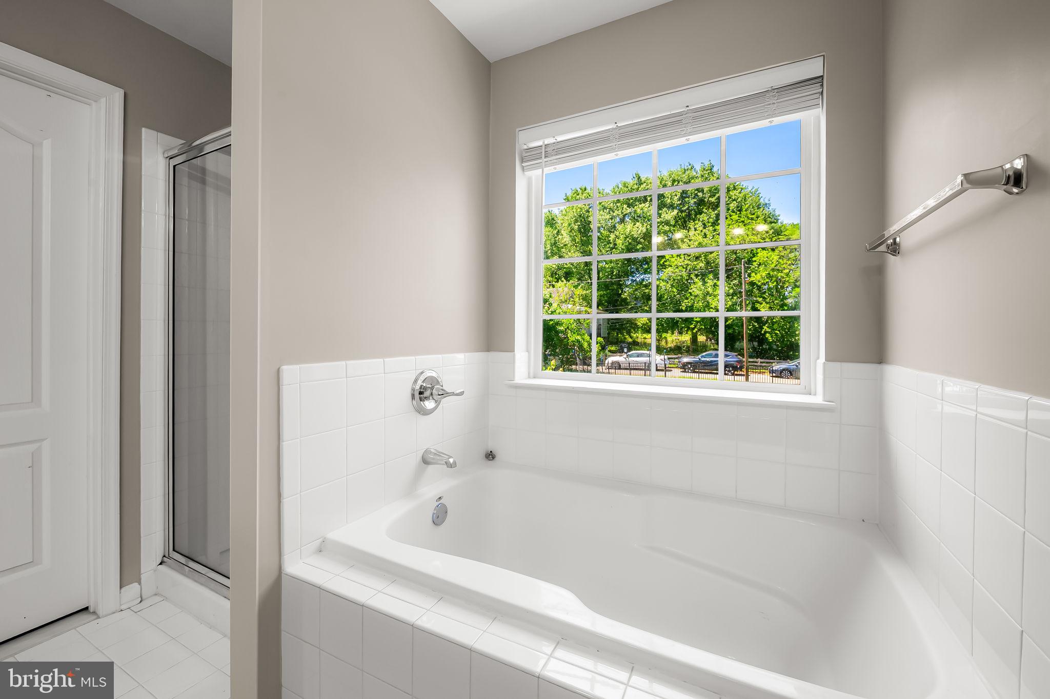 6008 Hanover Road Elkridge, MD 21075 - Photo 25 of 36 a bathroom with a bathtub and window