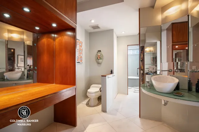 a bedroom with a bed and glass door