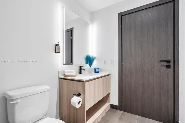 a bathroom with a sink a shower and a mirror