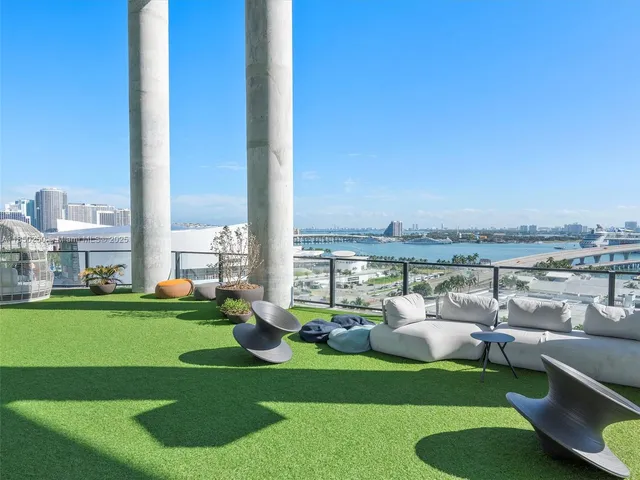 a view of a patio with couches chairs and a table