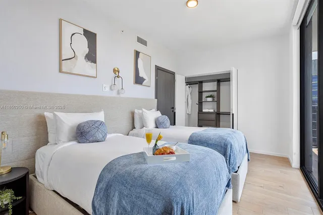 a bedroom with a bed and window