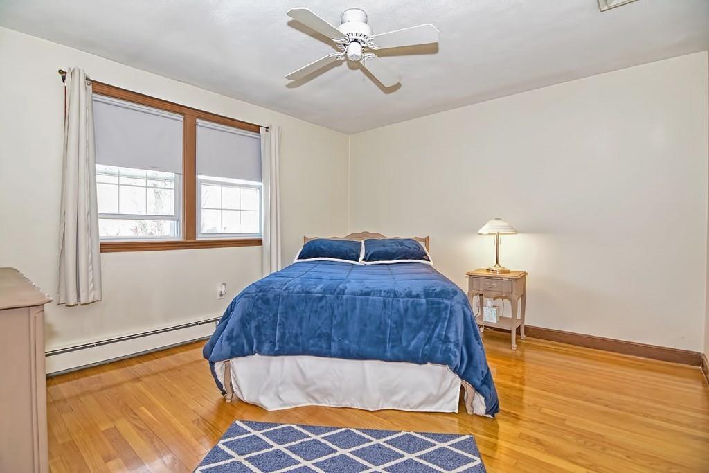 50 Cedarcrest Road Canton, MA 02021 - Photo 18 of 42 a bedroom with a bed and wooden floor
