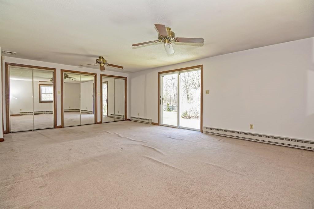 50 Cedarcrest Road Canton, MA 02021 - Photo 23 of 42 an empty room with chandelier fan and windows