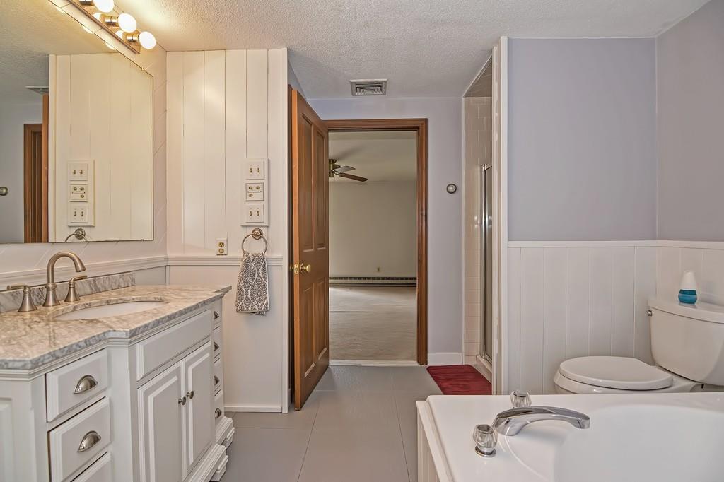 50 Cedarcrest Road Canton, MA 02021 - Photo 25 of 42 a bathroom with a granite countertop sink toilet and shower