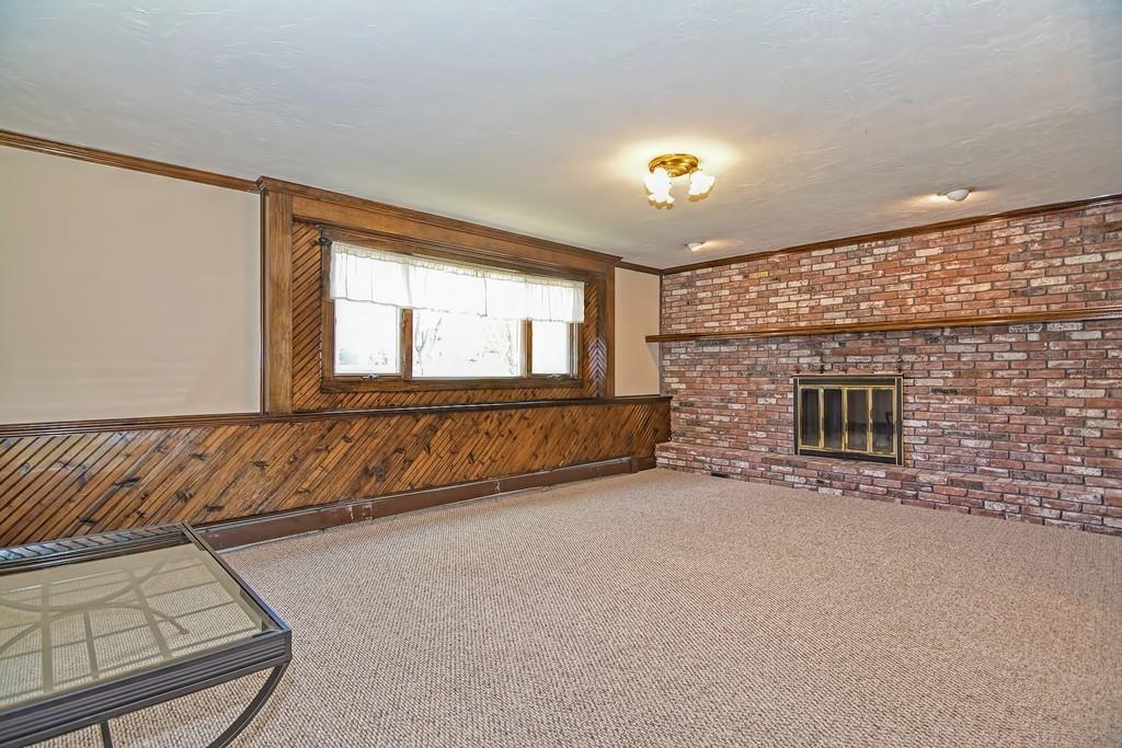 50 Cedarcrest Road Canton, MA 02021 - Photo 28 of 42 a view of an empty room with a fireplace and a window