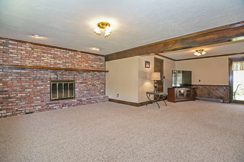 50 Cedarcrest Road Canton, MA 02021 - Photo 29 of 42 a view of a livingroom with furniture and a garage