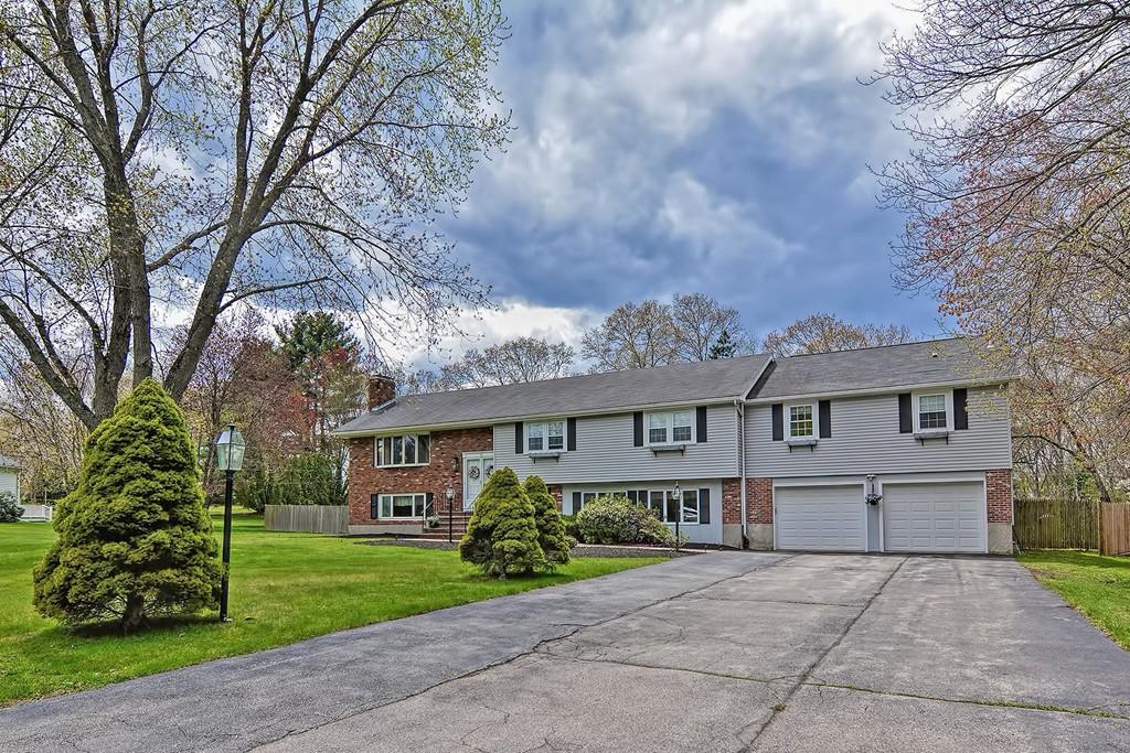 50 Cedarcrest Road Canton, MA 02021 - Photo 3 of 42 a front view of a house with garden