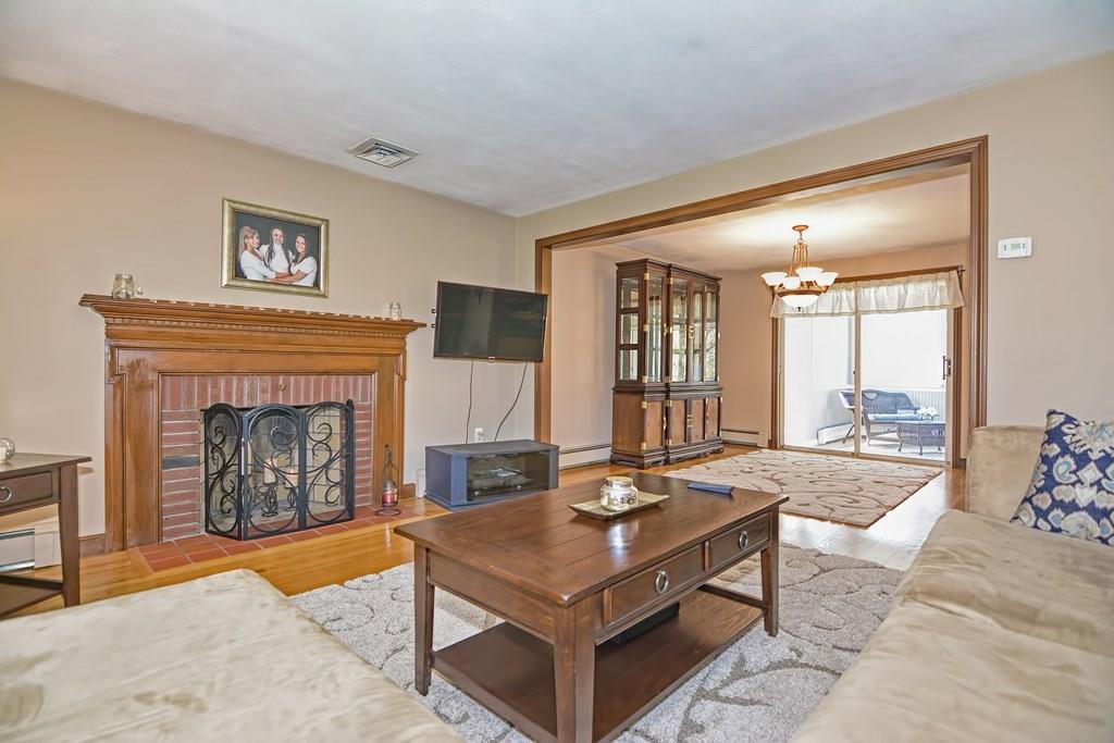 50 Cedarcrest Road Canton, MA 02021 - Photo 5 of 42 a living room with furniture and a fireplace