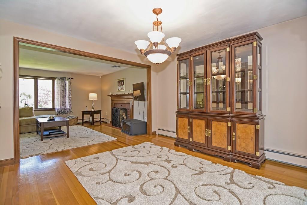 50 Cedarcrest Road Canton, MA 02021 - Photo 8 of 42 a living room with fireplace furniture and a wooden floor