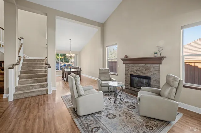 a kitchen with a stove a sink a refrigerator and cabinets