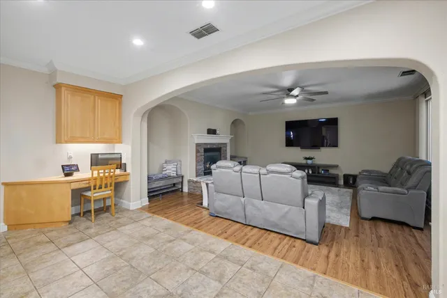 a spacious en suite bathroom with a sink double vanity granite and a mirror