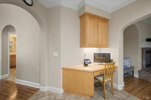 a spacious bathroom with a sink a toilet a mirror and shower