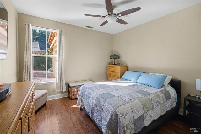 a view of a glass door with a balcony from a window