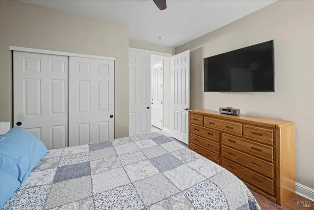 a bedroom with a bed and a desk