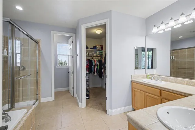 a view of a house with backyard porch and sitting area
