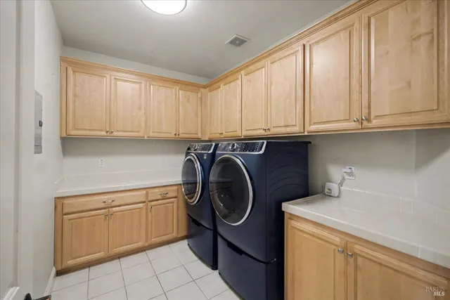 a view of a house with backyard porch and sitting area
