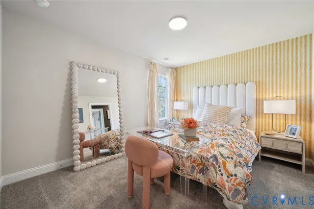 a bedroom with a bed and a bathroom