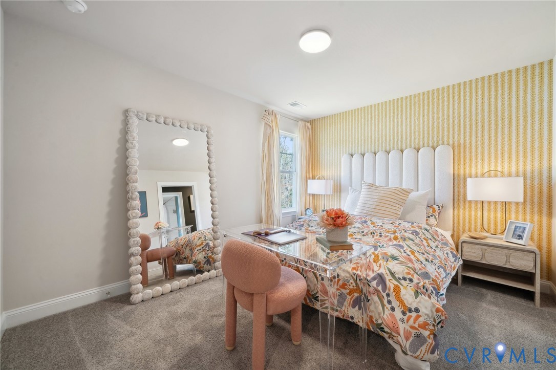 16800 Barmer Road Chesterfield, VA 23832 - Photo 16 of 28 a bedroom with a bed and a chandelier