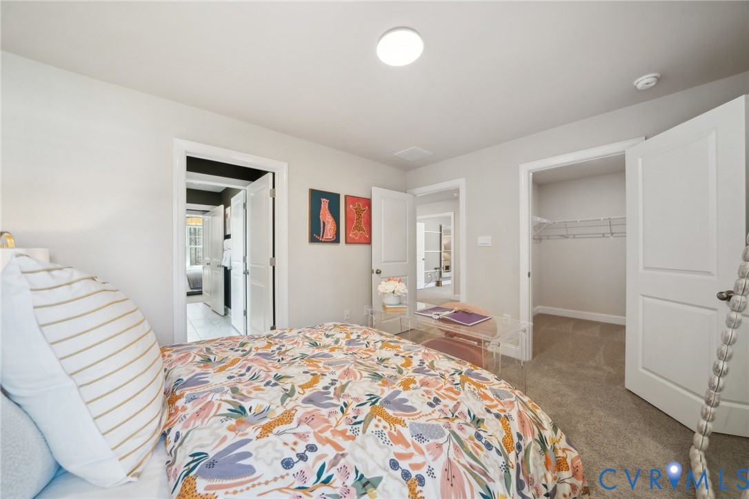 16800 Barmer Road Chesterfield, VA 23832 - Photo 17 of 28 a bedroom with a bed and a bathroom