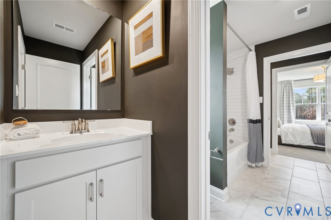 16800 Barmer Road Chesterfield, VA 23832 - Photo 19 of 28 a en suite bathroom with a sink and a mirror