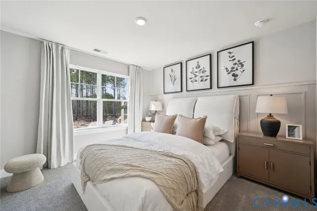 a bedroom with a bed and a view of bathroom