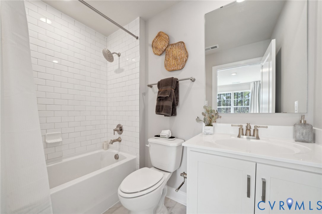 16800 Barmer Road Chesterfield, VA 23832 - Photo 26 of 28 a bathroom with a granite countertop toilet sink and mirror