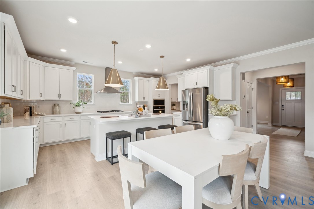 16800 Barmer Road Chesterfield, VA 23832 - Photo 7 of 28 a kitchen with white cabinets and refrigerator