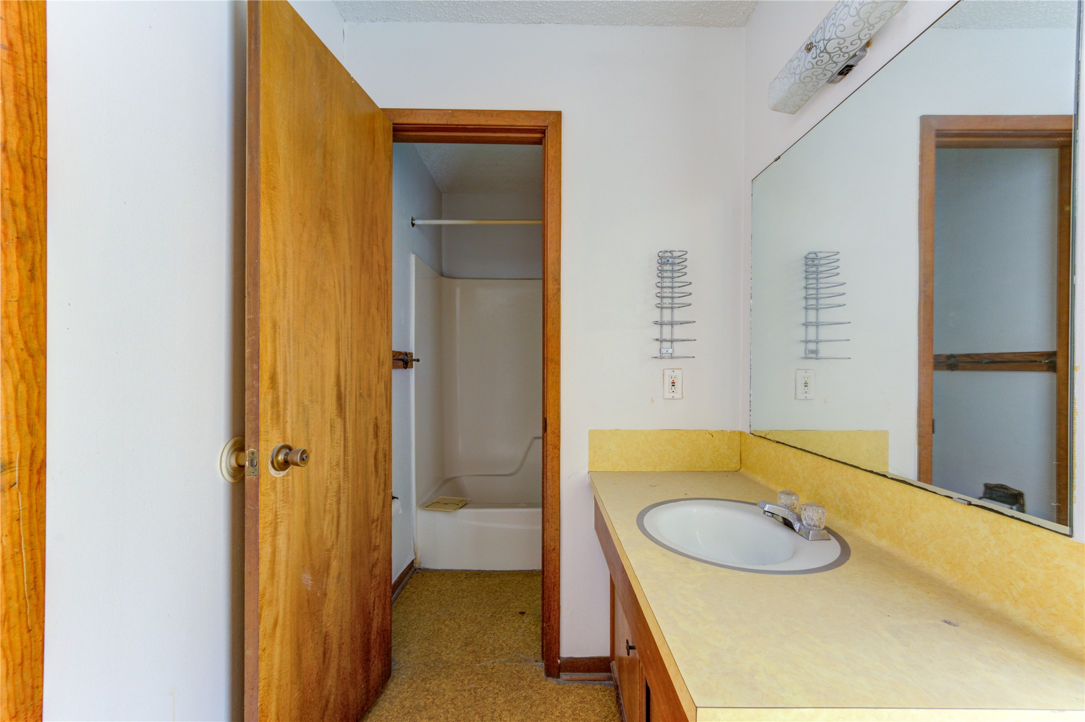 4602 Avenue H Rosenberg, TX 77471 - Photo 24 of 42 a bathroom with a sink and a mirror