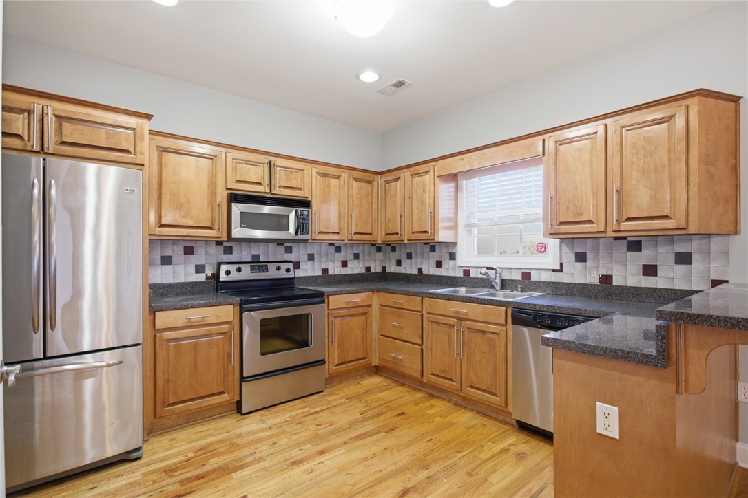 201 Providence Court Seneca, SC 29678 - Photo 12 of 33 This spacious kitchen offers ample cabinetry, modern appliances, and a convenient layout.