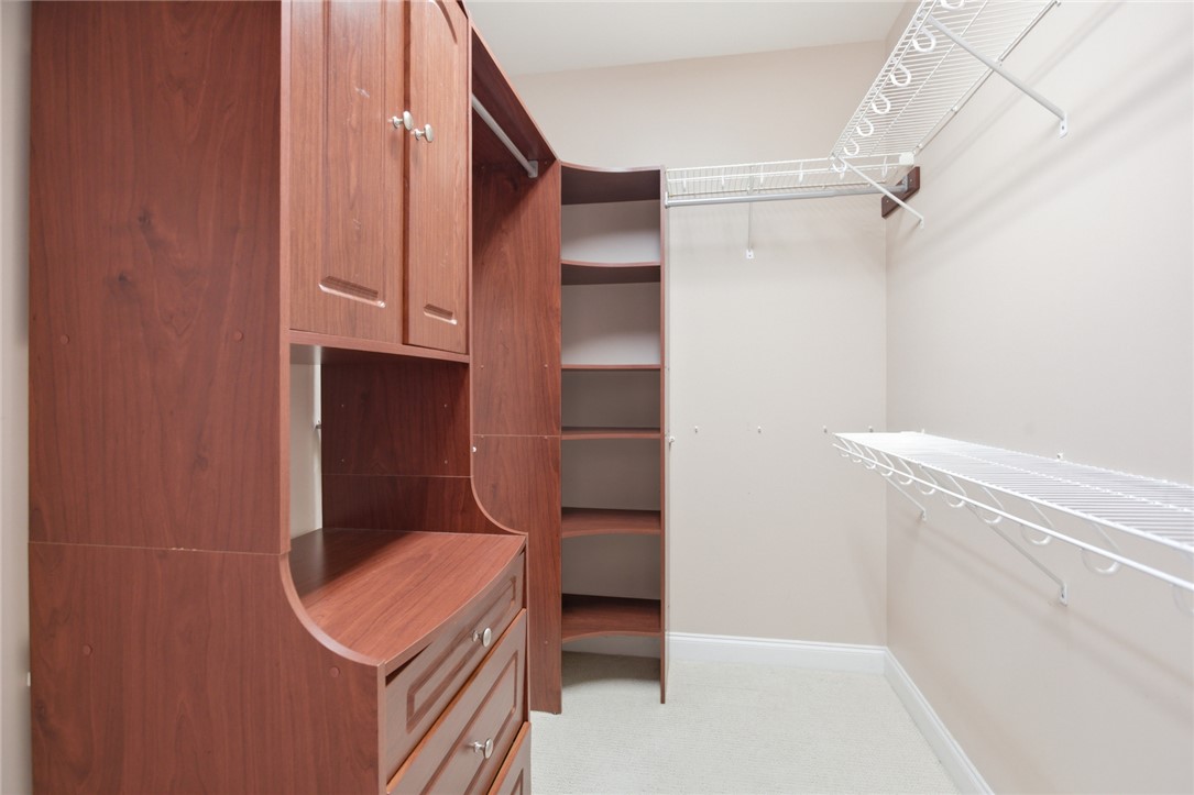 201 Providence Court Seneca, SC 29678 - Photo 17 of 33 This spacious walk-in closet offers extensive built-in storage solutions for organized living.