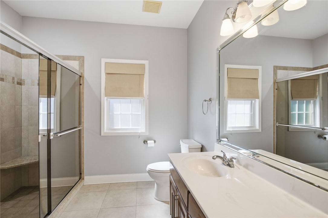 201 Providence Court Seneca, SC 29678 - Photo 19 of 33 This bright bathroom features a spacious shower and ample counter space for daily routines.