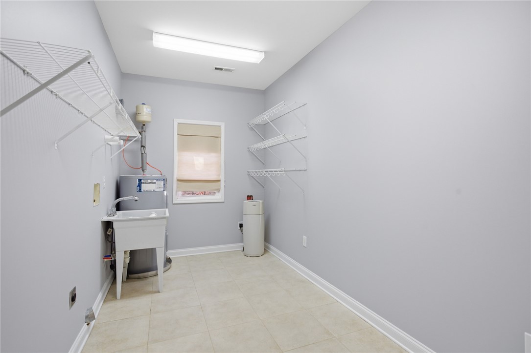 201 Providence Court Seneca, SC 29678 - Photo 23 of 33 This spacious utility area features convenient storage solutions and practical amenities for daily tasks.