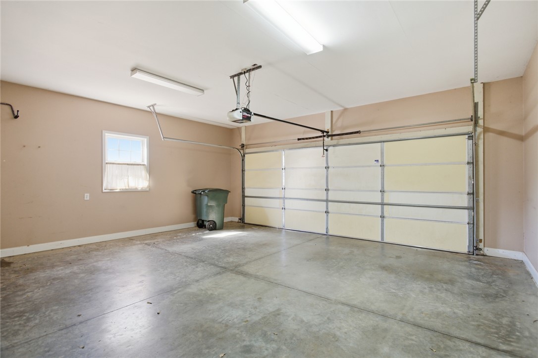 201 Providence Court Seneca, SC 29678 - Photo 27 of 33 This spacious garage offers ample storage and direct access, perfect for convenience and organization.