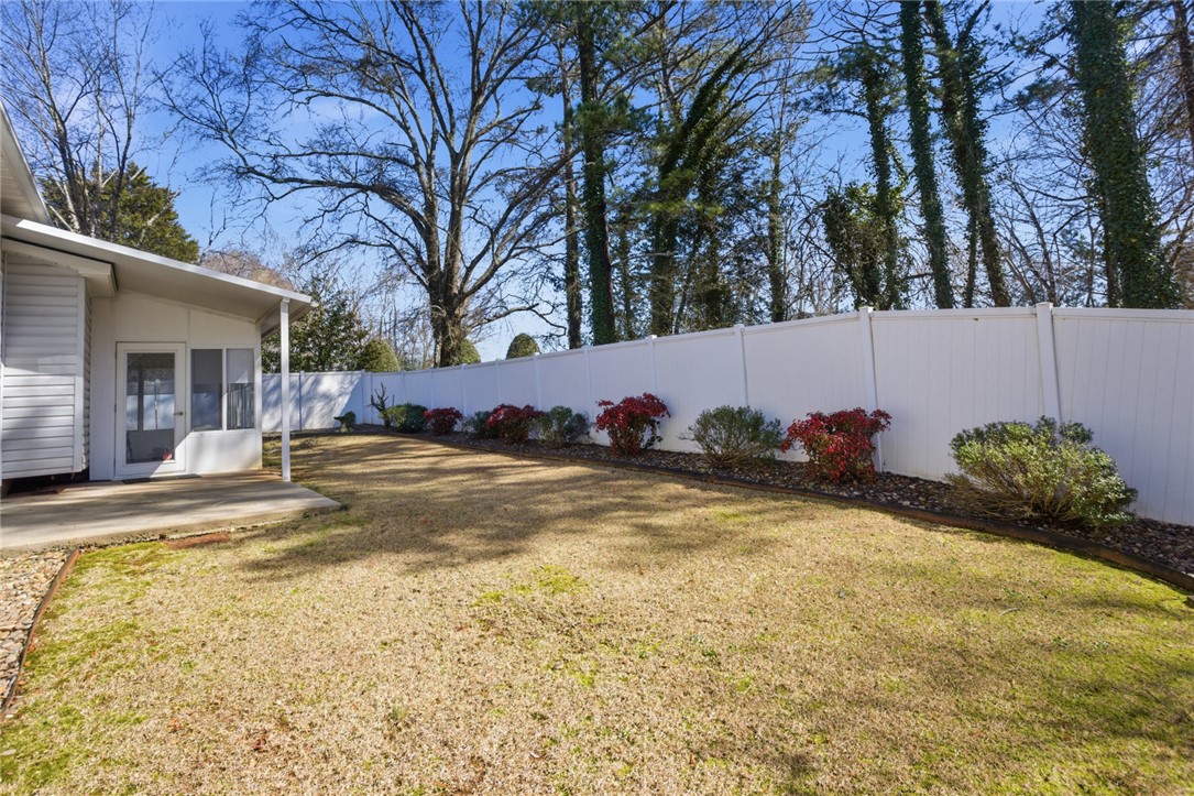 201 Providence Court Seneca, SC 29678 - Photo 7 of 33 This tranquil yard features a private fence and mature trees, perfect for relaxation.