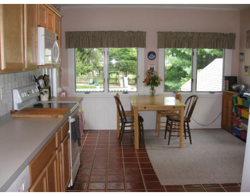 20 Fairview Road Needham, MA 02492 - Photo 6 of 9 a view of a dining room with furniture window and outside view
