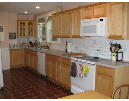 20 Fairview Road Needham, MA 02492 - Photo 7 of 9 a kitchen with stainless steel appliances a sink stove and cabinets