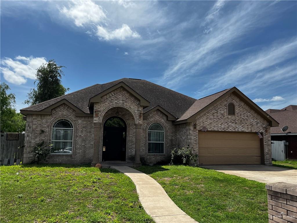 1706 School Lane Mission, TX 78572 - Photo 1 of 1 a front view of a house with a garden