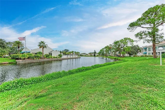 a view of a lake with a house in the background