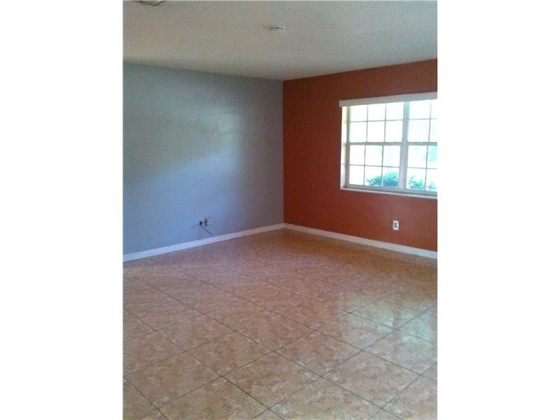5749 Buchanan Street Hollywood, FL 33021 - Photo 2 of 6 a view of an empty room with a window