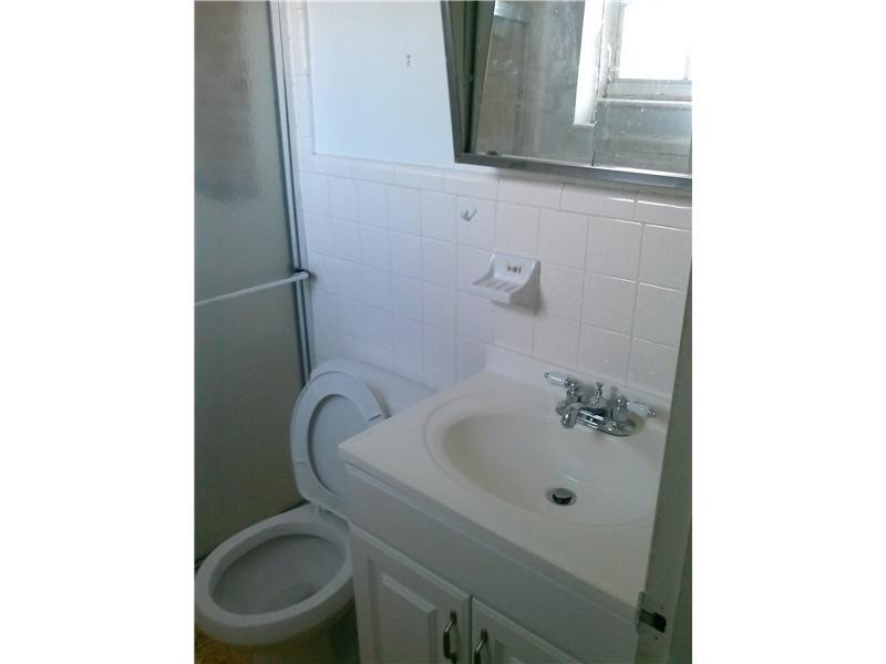 5749 Buchanan Street Hollywood, FL 33021 - Photo 5 of 6 a bathroom with a toilet and sink