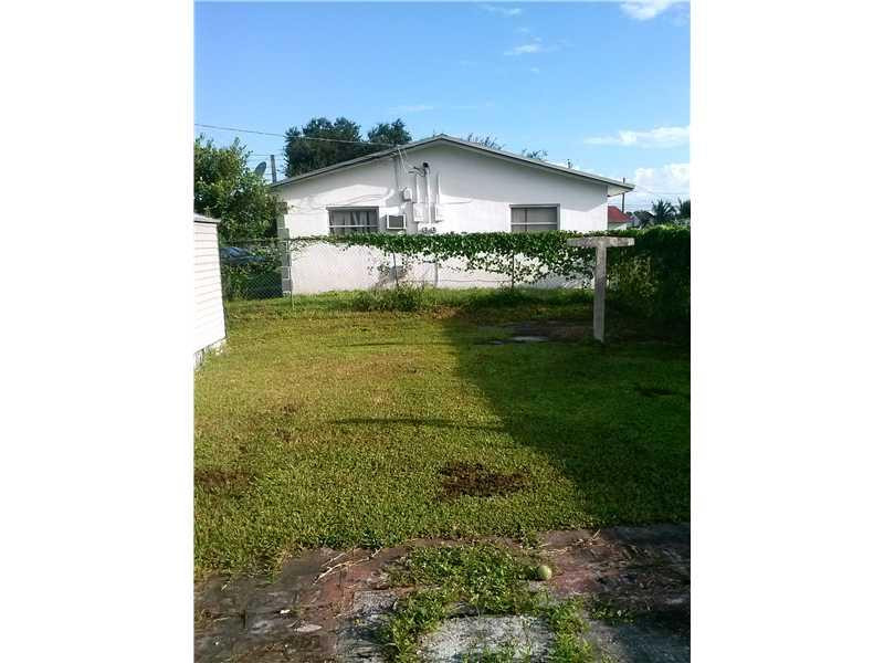 5749 Buchanan Street Hollywood, FL 33021 - Photo 6 of 6 a view of a house with a yard