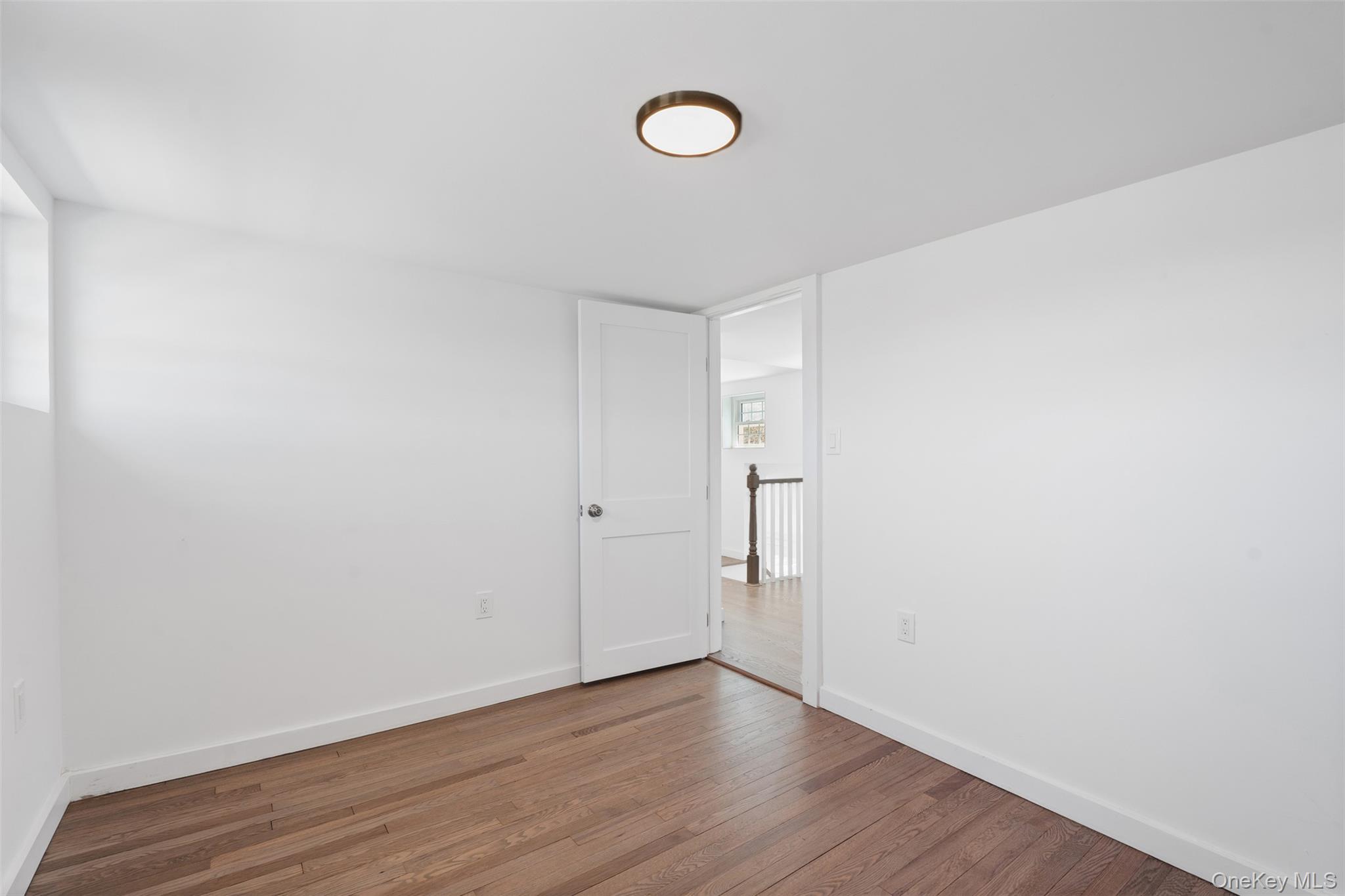 70 Barmore Road LaGrangeville, NY 12540 - Photo 22 of 47 Spare room featuring wood finished floors and baseboards
