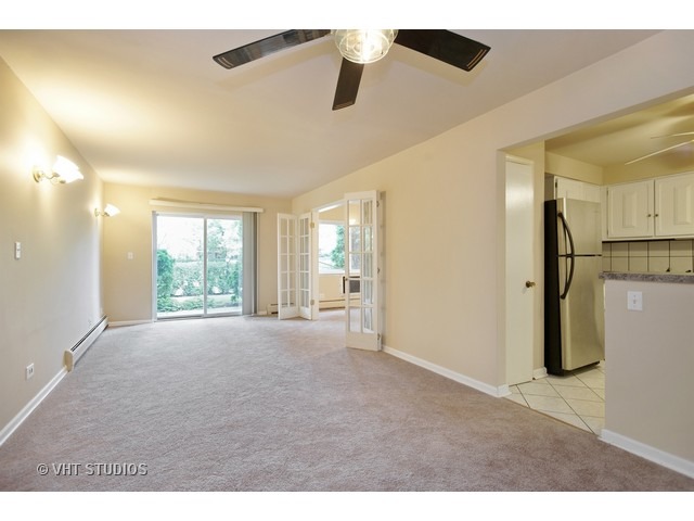 2315 South Goebbert Road, Unit D106 Arlington Heights, IL 60005 - Photo 2 of 11 a view of an empty room with a window